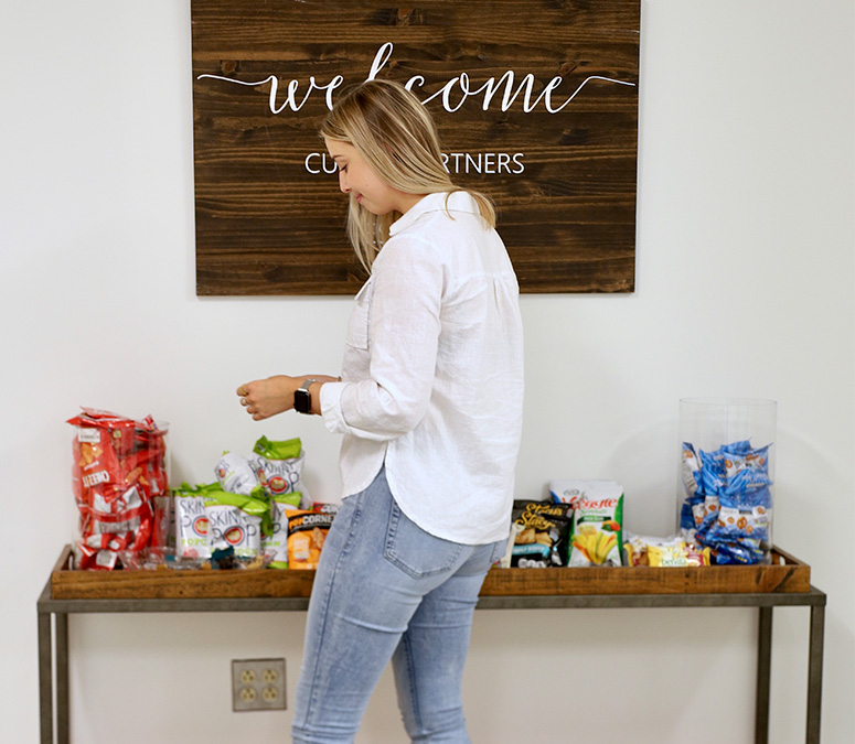 employee browsing the snack bar option in a kitchen at the office