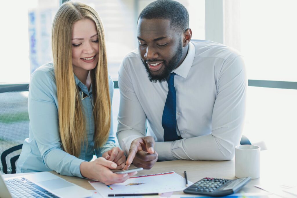 Financial organization employees discussing performance metrics